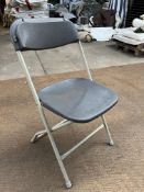 100 Samsonite folding chairs, charcoal. This lot is subject to VAT.