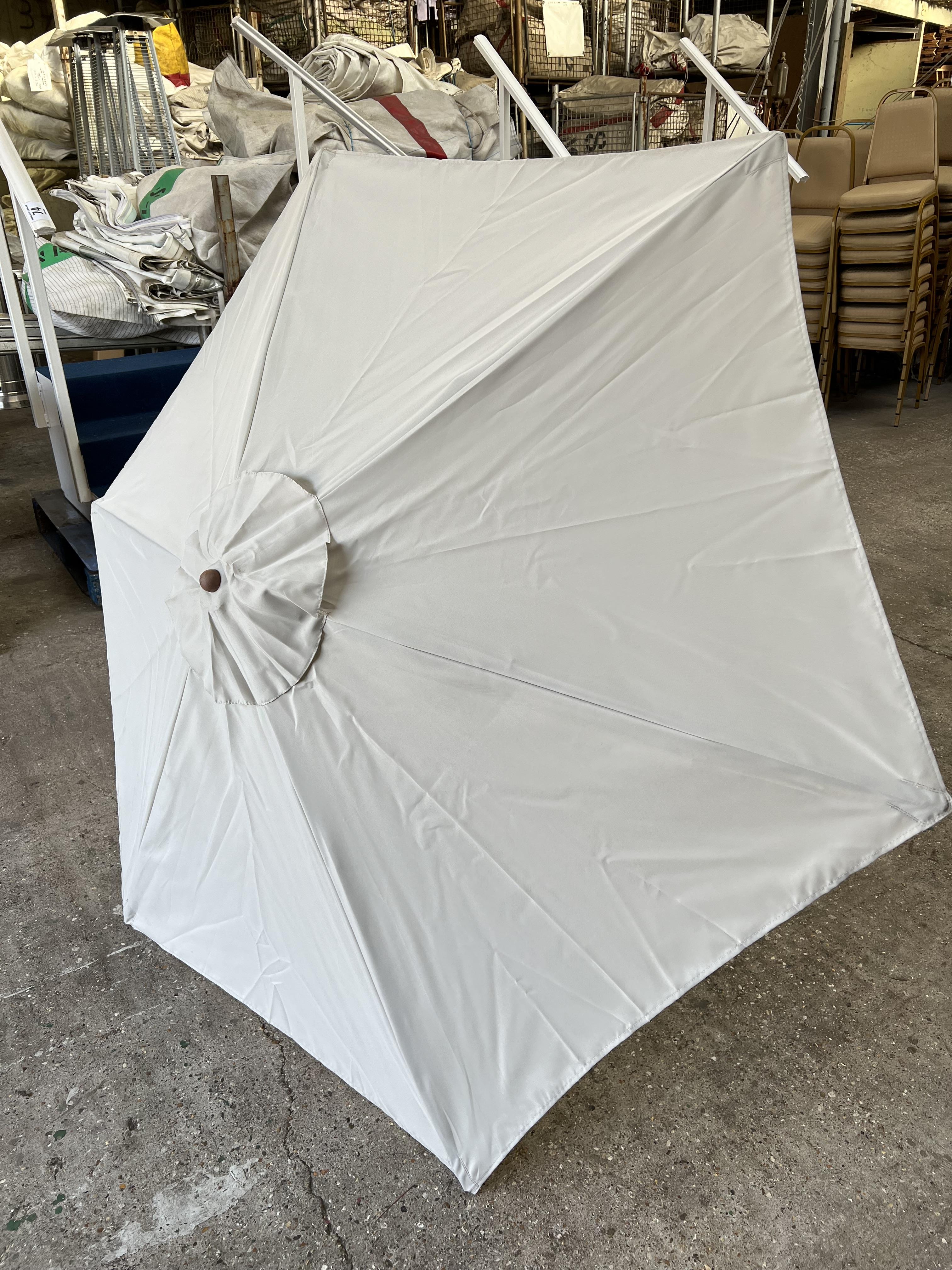 1 no 2m diameter cream garden umbrella. This lot is subject to VAT