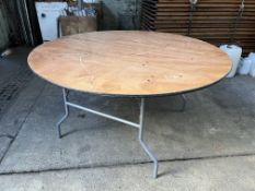 16 no 5ft diameter round tables with folding legs and plywood top. This lot is subject to VAT.