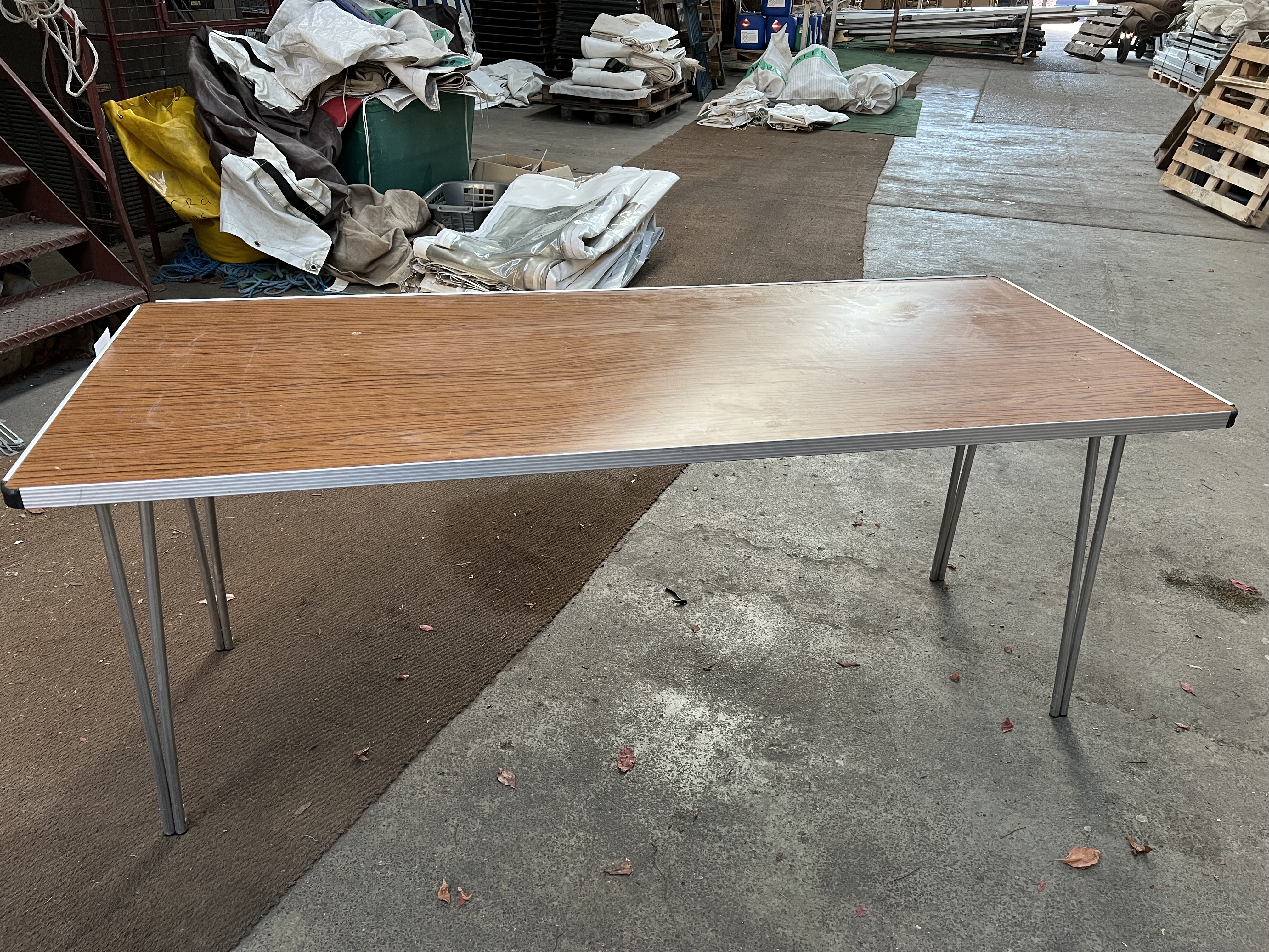 15 Gopak 6ft trestle tables with folding legs and melamine top. This lot is subject to VAT.