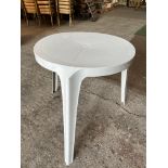 12 circular 3 legged white resin tables 70cms diameter x 73cms high. This lot is subject to VAT