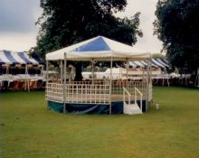6m octagonal band stand, blue & white roof, with steel floor and boards. The lot is subject to VAT