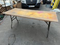25 no 6ft trestle tables with metal folding legs and plywood top. This lot is subject to VAT.