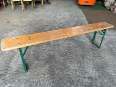7 no 6ft long wooden benches with metal folding legs. This lot is subject to VAT