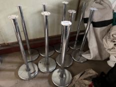 9 chrome stanchions, height 95cms. This lot is subject to VAT