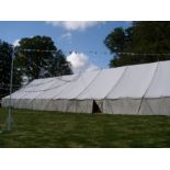 95ft x 40ft pole marquee with white canvas roof and PVC walls. This lot is subject to VAT