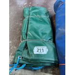 Dark green PVC tarpaulin 12ft x 9ft hemmed and eyeletted. This lot is subject to VAT