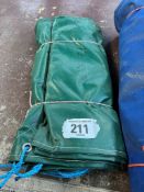 Dark green PVC tarpaulin 12ft x 9ft hemmed and eyeletted. This lot is subject to VAT