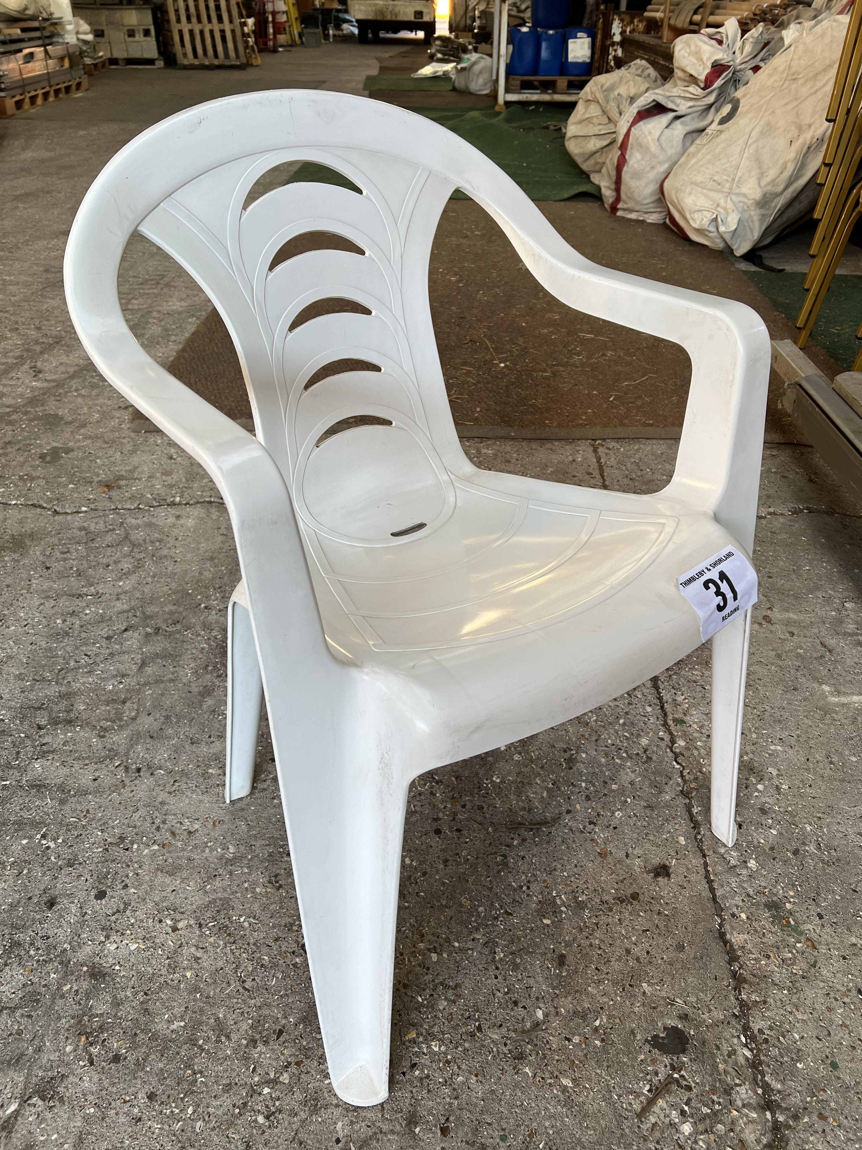 50 white resin garden armchairs. This lot is subject to VAT