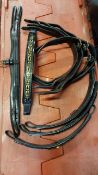Four leather bridle headpieces with browbands
