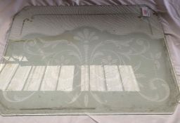 A sheet of glass with decorative etching suitable for a living wagon with other sheets of glass.