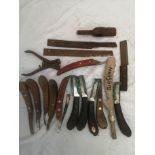 Selection of Farriers knives, tools, rasps with a Farriers hoof jack.