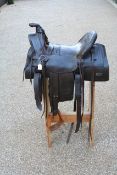 Early 3/4 seat western saddle by Frank A Meanea Cheyenne W T c1880 with stand.