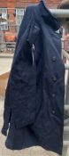 Two ex-Police large black long riding coats, one showerproof by J & S, the other waterproof