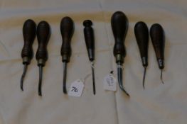 Selection of tools: three shaves, nail claw, and three awls