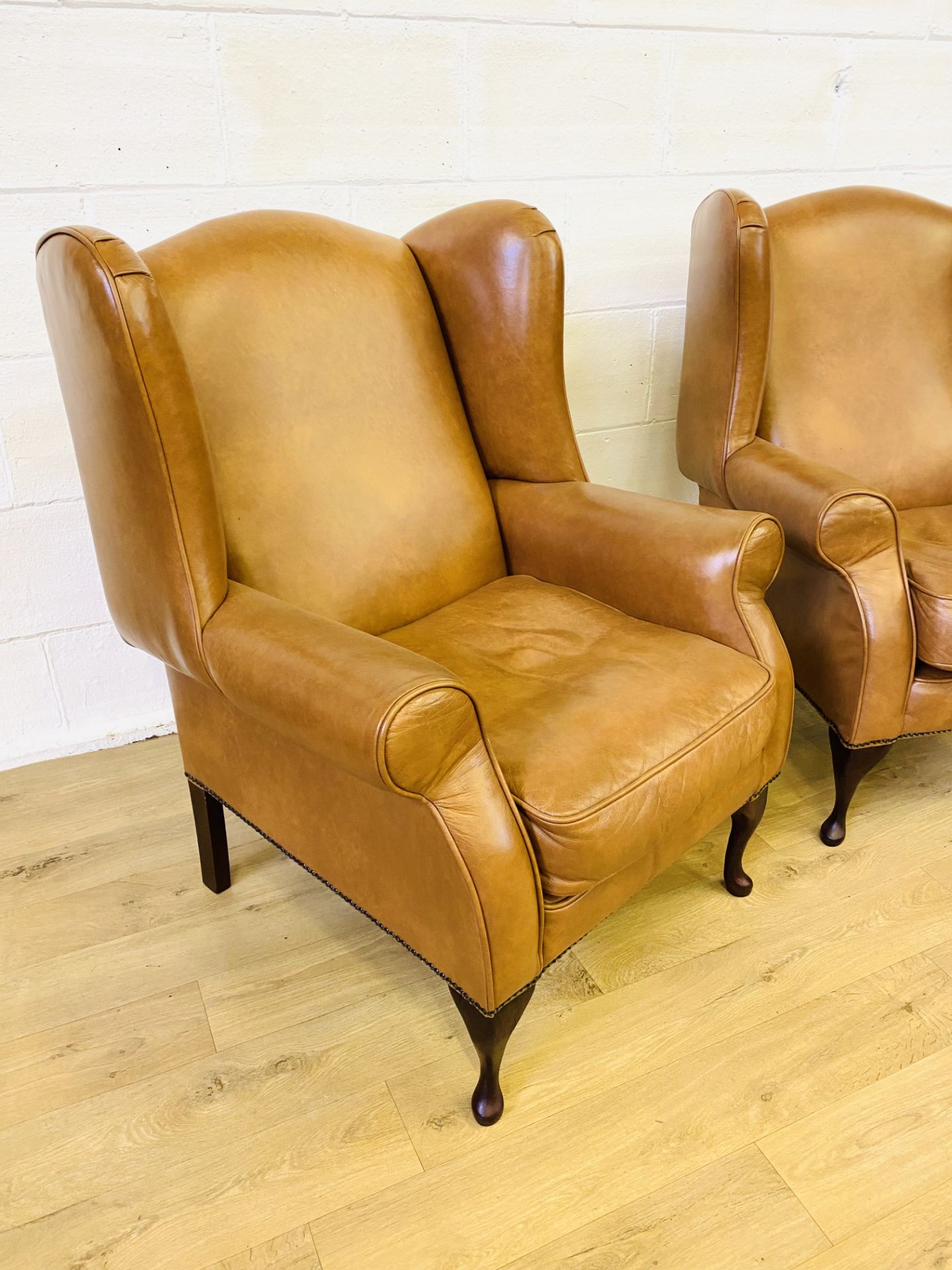 Pair of brown leather style wingback armchairs - Image 3 of 4