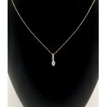 9ct gold chain and pendant set with an aquamarine and diamond