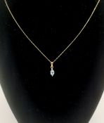 9ct gold chain and pendant set with an aquamarine and diamond