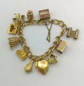 9ct gold charm bracelet with eleven charms