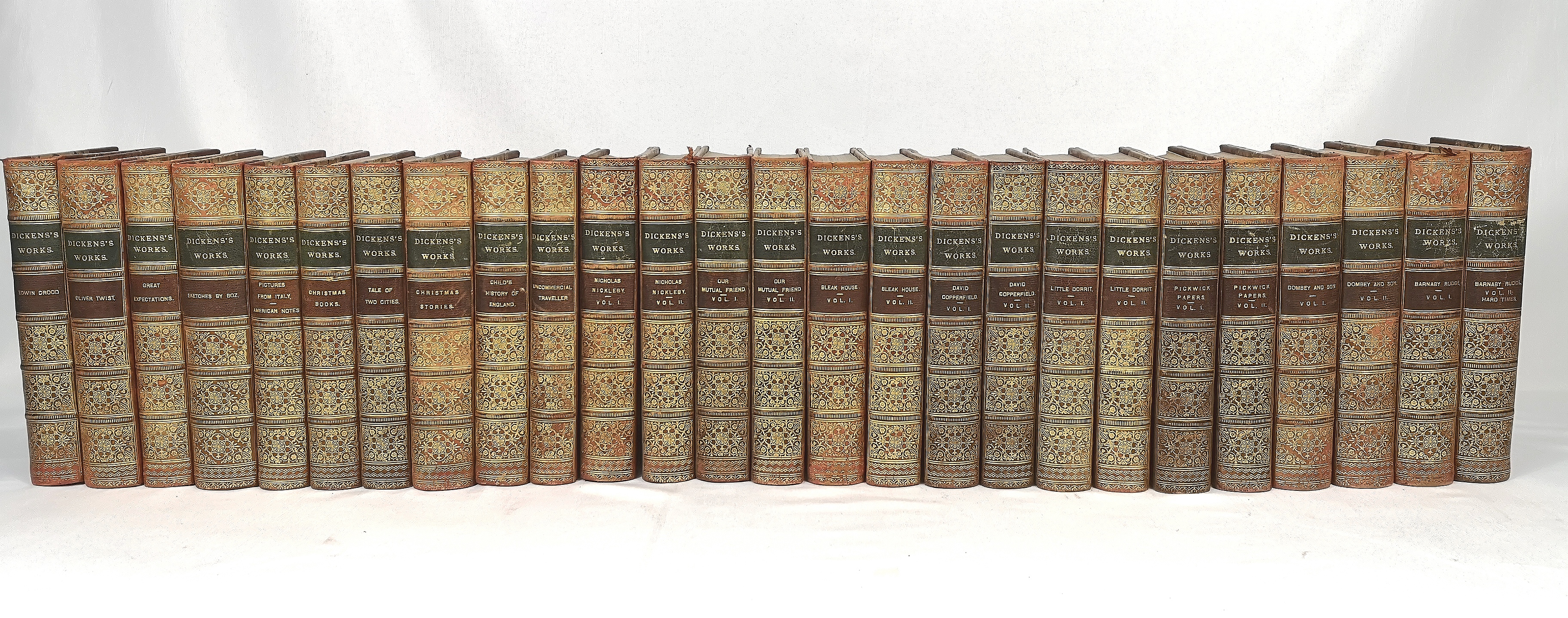 Dickens Works, twenty six half bound books