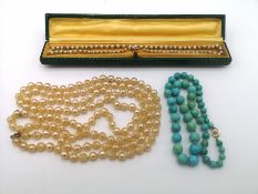 Two pearl necklaces and a turquoise necklace, all with 9ct gold clasps