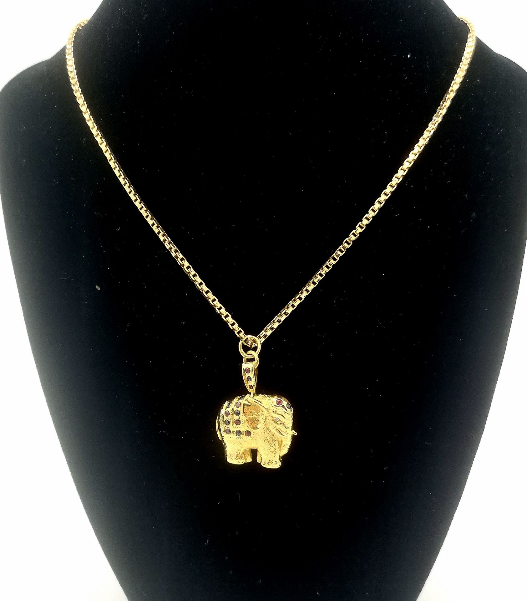 18ct gold elephant pendant set with gemstones on 18ct gold chain