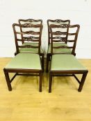 Four mahogany ladder back chairs