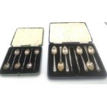 Two sets of silver spoons