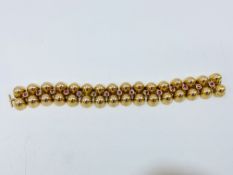 18ct gold bracelet set with fifteen rubies