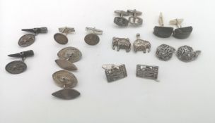 Six pairs of silver cufflinks