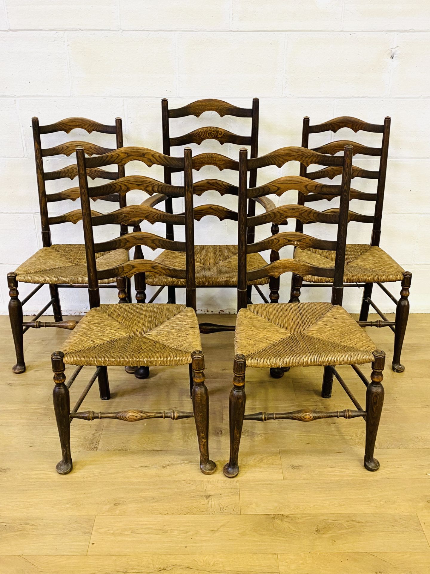 Five oak ladderback dining chairs