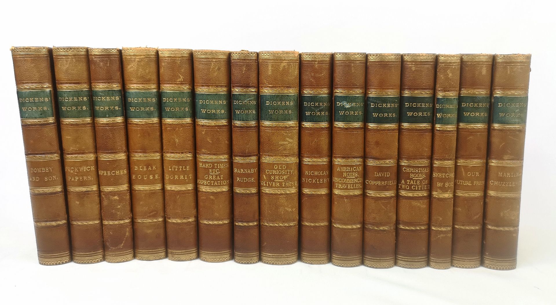 Dickens Works, fifteen half bound volumes by Charles Dickens