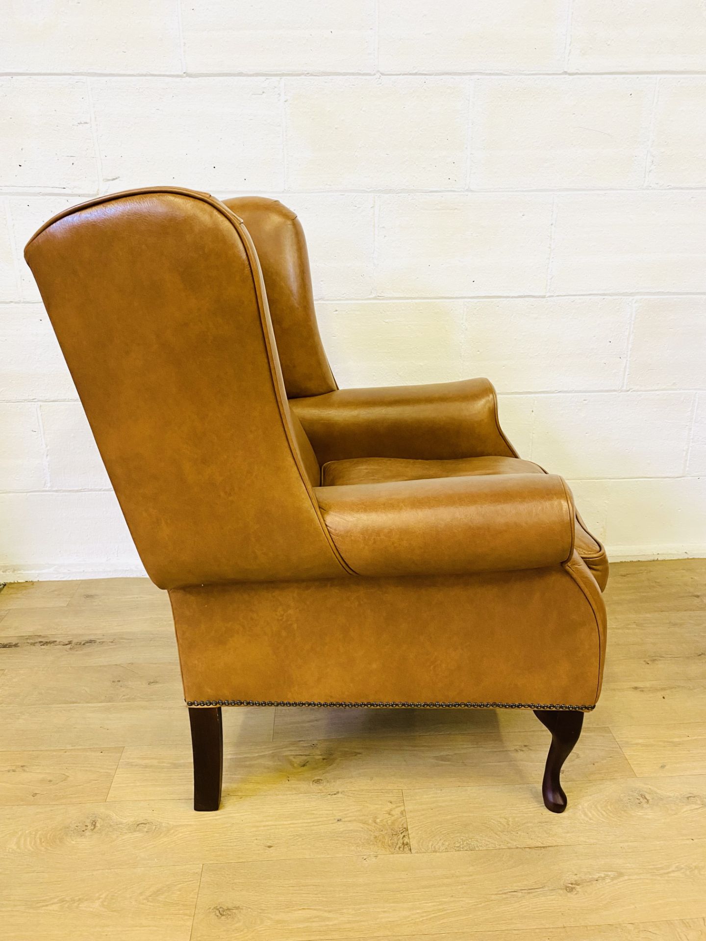 Pair of brown leather style wingback armchairs - Image 4 of 4