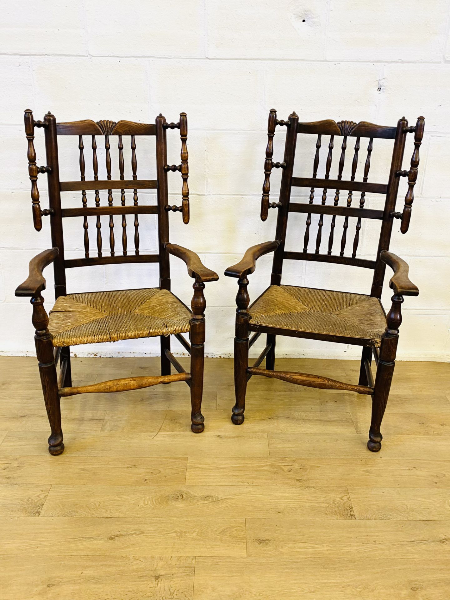 Pair of oak arts and crafts style armchairs