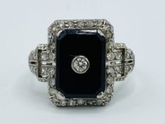 Platinum ring set with black onyx and diamonds
