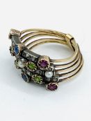 Gold multi band ring, set with peridot, rubies, diamonds, sapphires and pearls