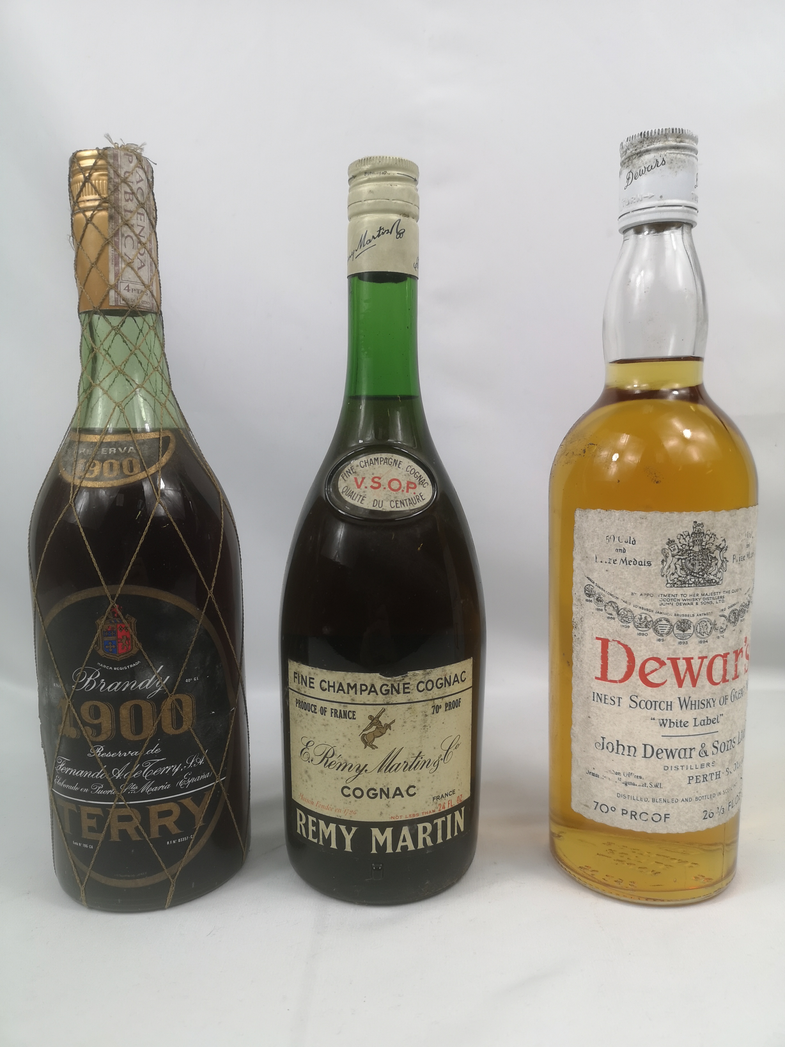 Bottle of Dewars scotch whisky, bottle of brandy and cognac