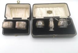 Three piece silver cruet set, two silver napkin rings