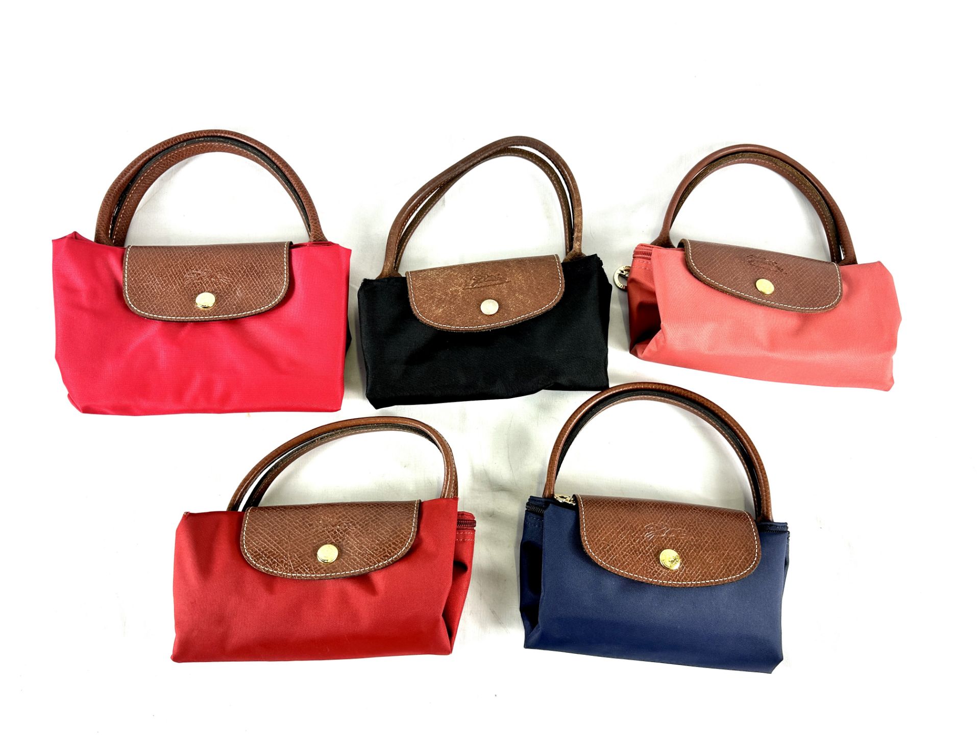 Five Longchamps fold out canvas bags with leather trim