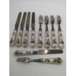 Ten fruit knives and forks with silver blades and tines