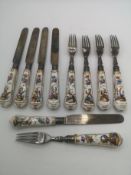 Ten fruit knives and forks with silver blades and tines