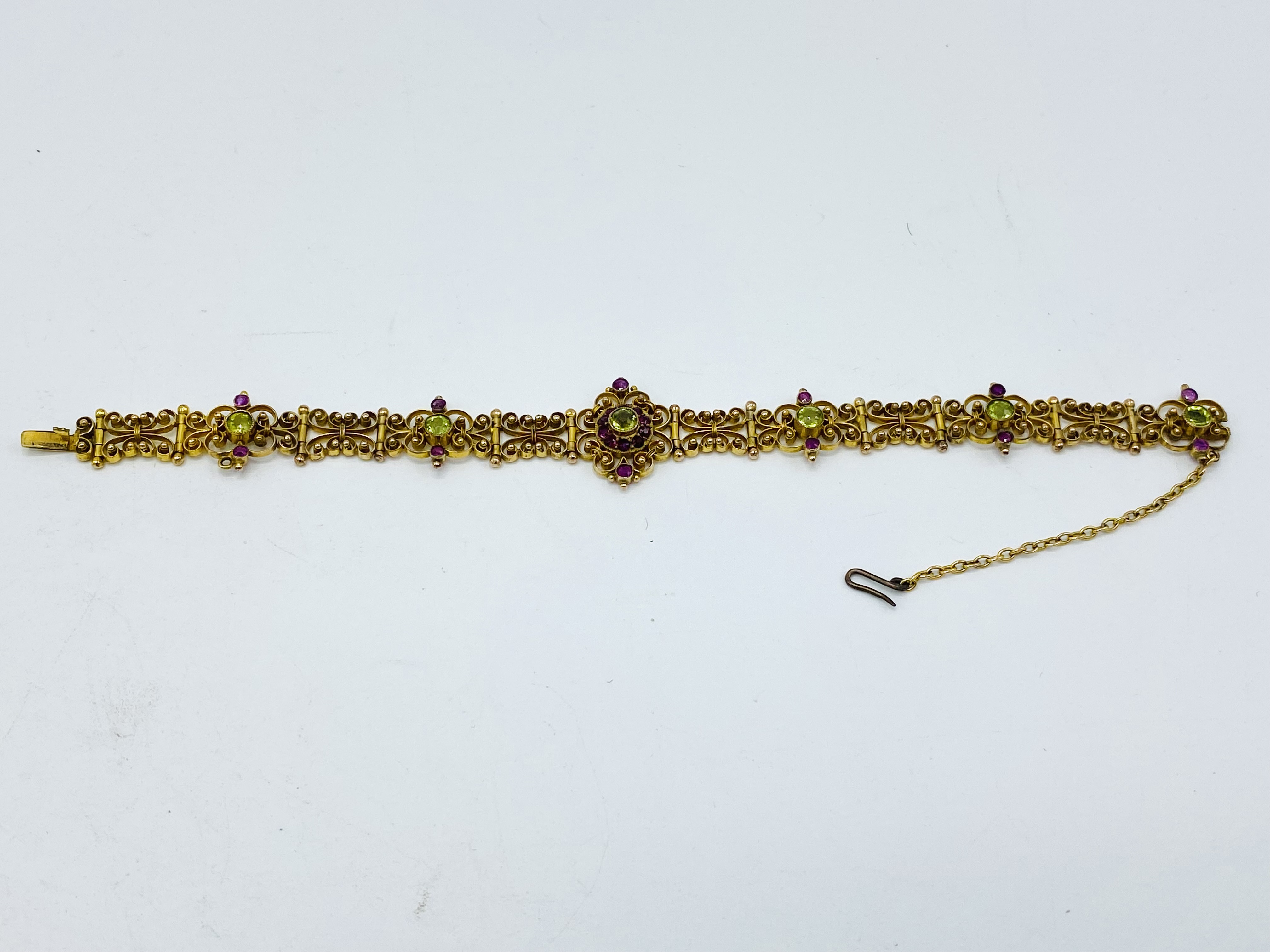 Gold filigree bracelet set with rubies and peridot