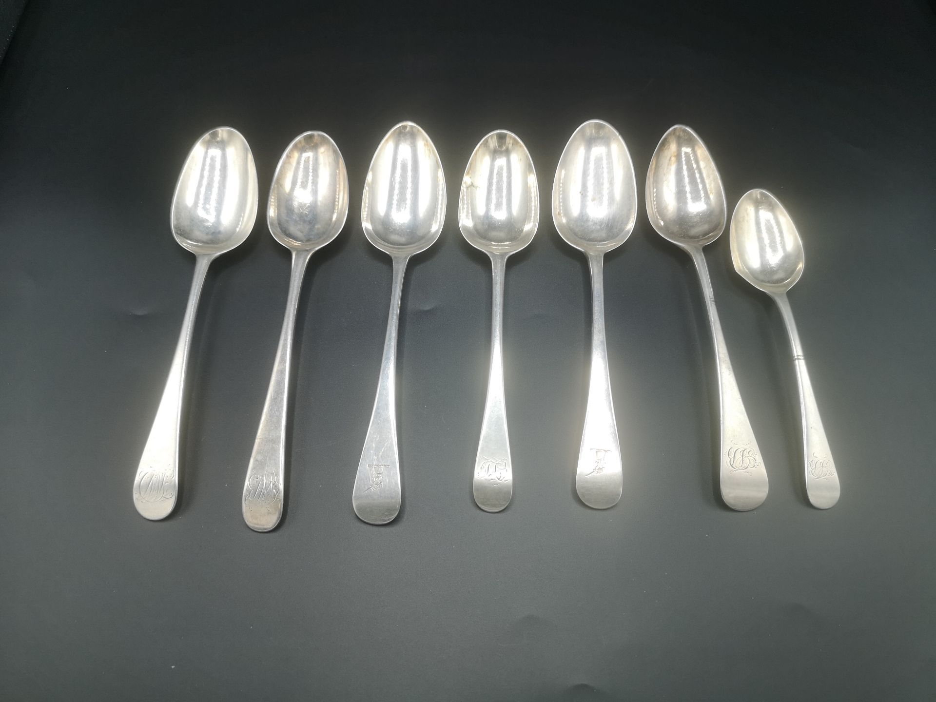 Two Georgian silver spoons with five other silver spoons