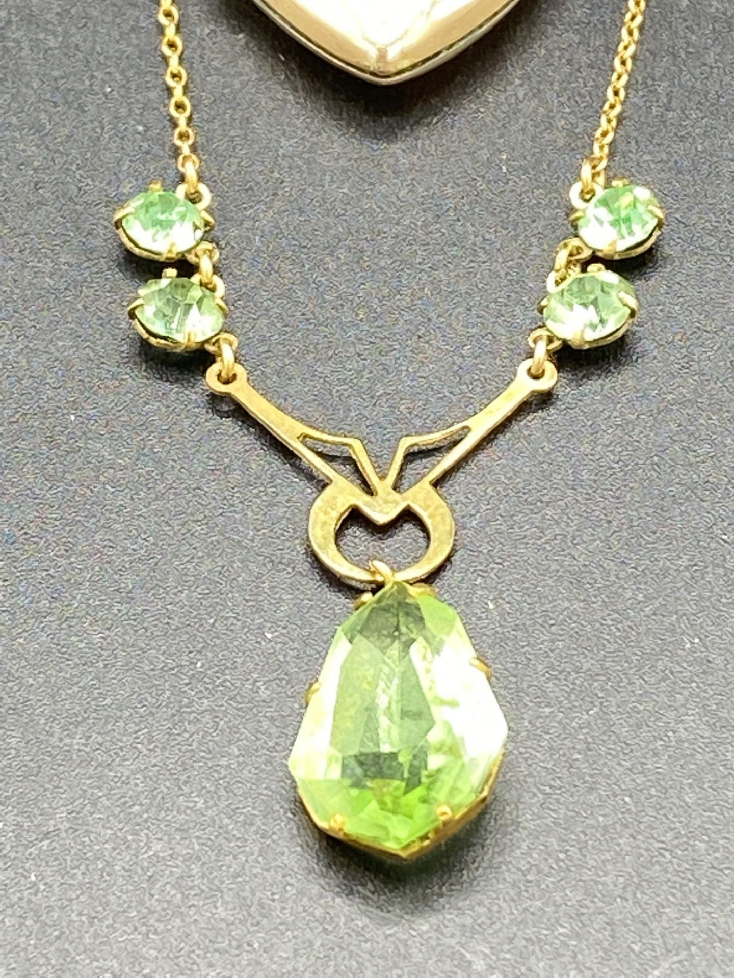 9ct gold necklace set with a pale green teardrop and a 9ct gold diamond set locket - Image 2 of 7
