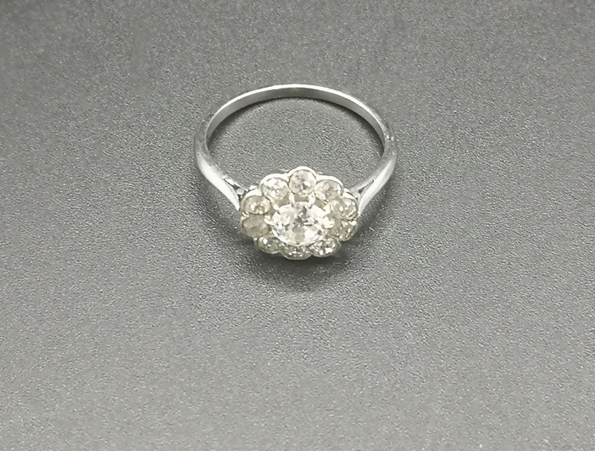 White metal and diamond cluster ring