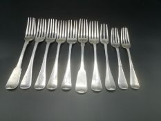 Five Georgian silver forks with five other silver forks