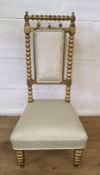 Bobbin turned upholstered armchair