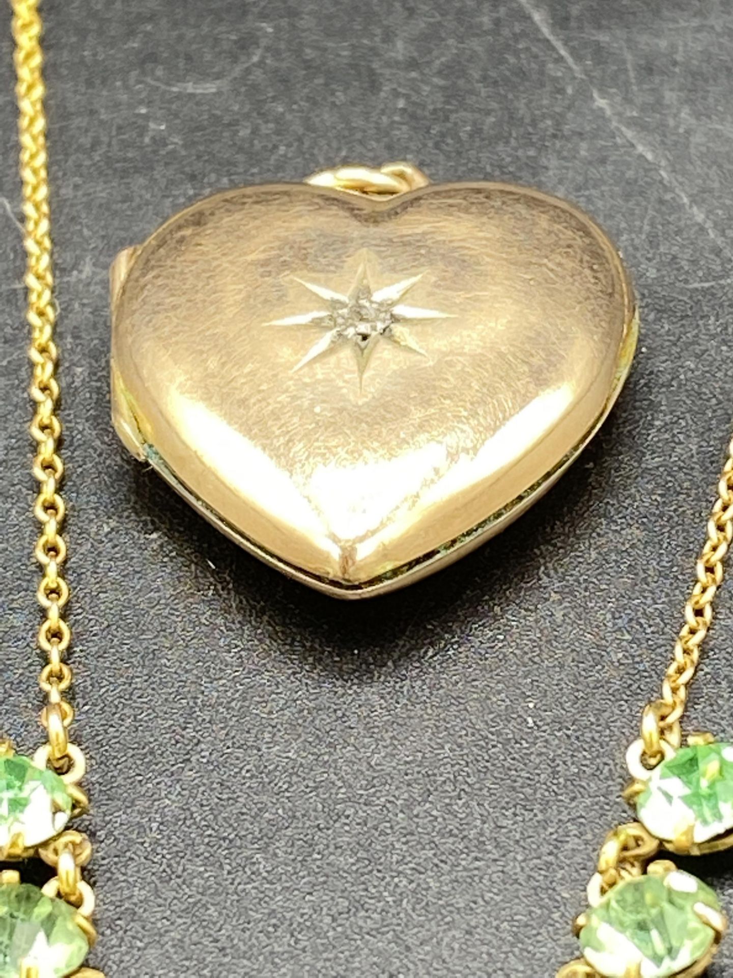 9ct gold necklace set with a pale green teardrop and a 9ct gold diamond set locket - Image 3 of 7
