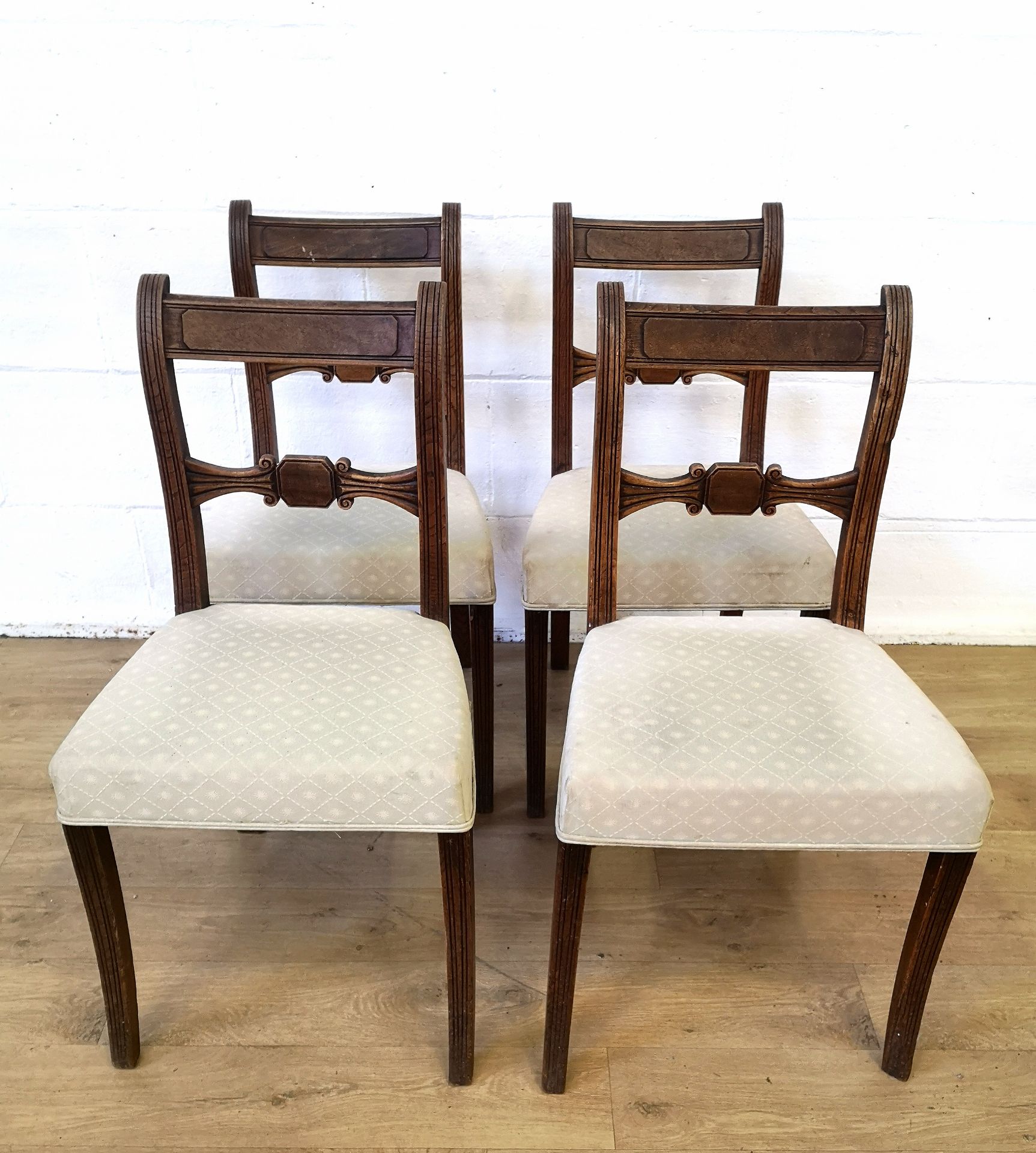 Four oak ladder back dining chairs