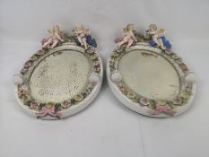 Two Continental porcelain oval mirrors